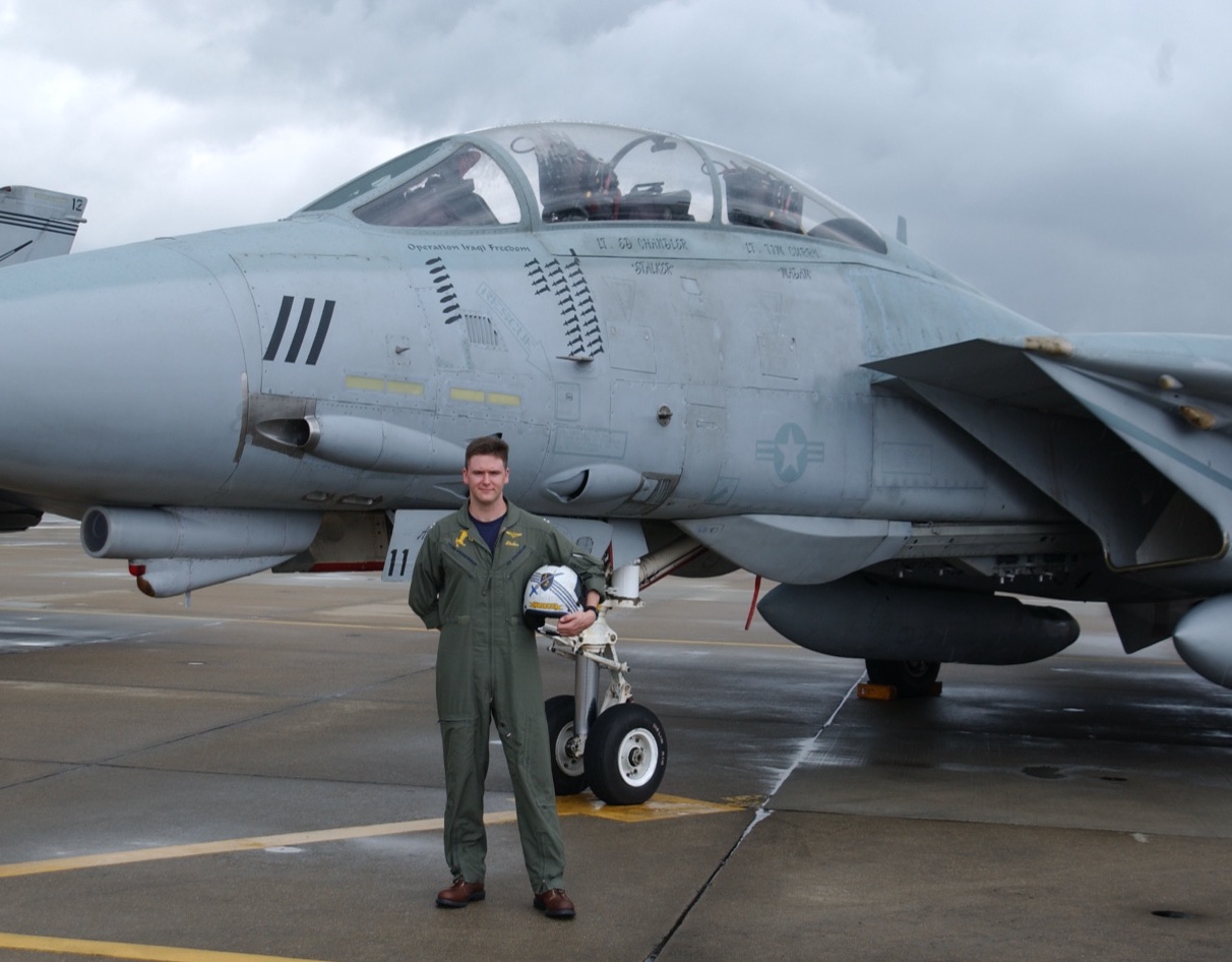 Ed Chandler, TOPGUN graduate and instructor, with an F-14 Tomcat